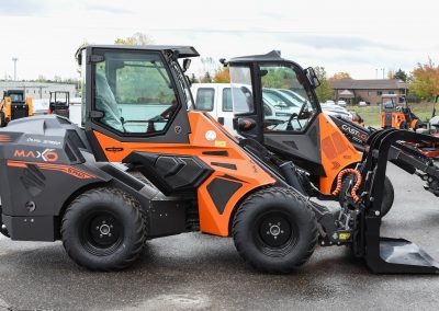 Cast Loaders MAXO with TNA Log Grapple at TNE Distributing attachments for compact articulating loaders